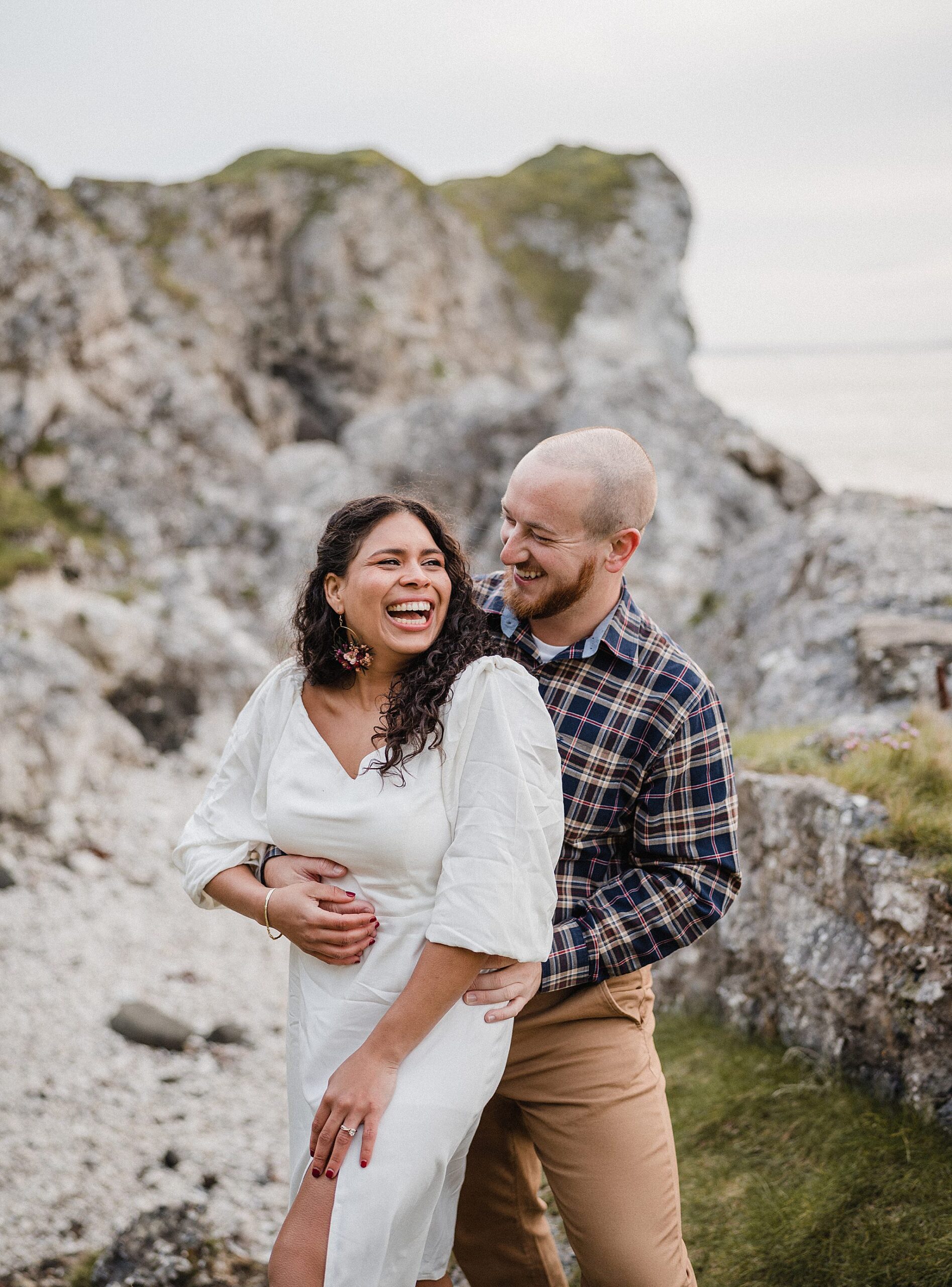 couple laughing during engagement shoot 