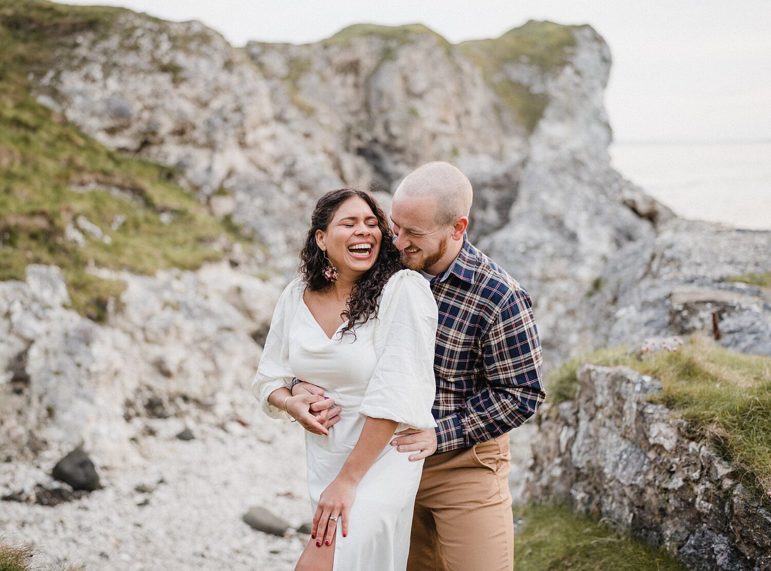 couple laughing at Castle during sunrise