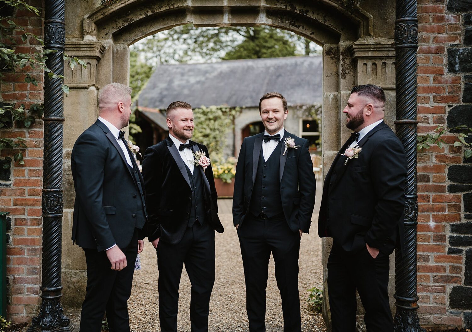 groomsmen outside arch at the Phantom House at Galgorm Resort