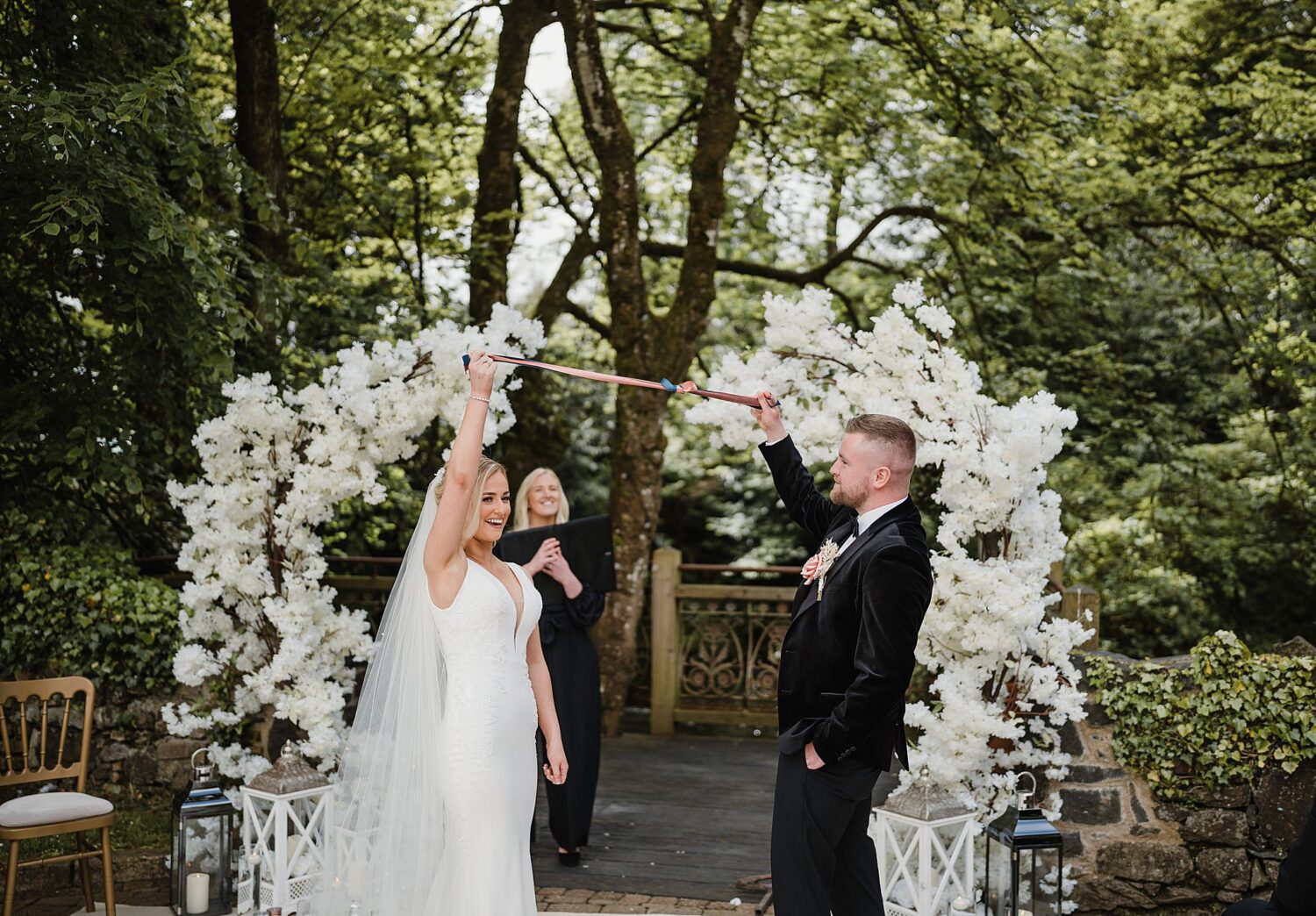 bride and groom tie the knot during ceremony