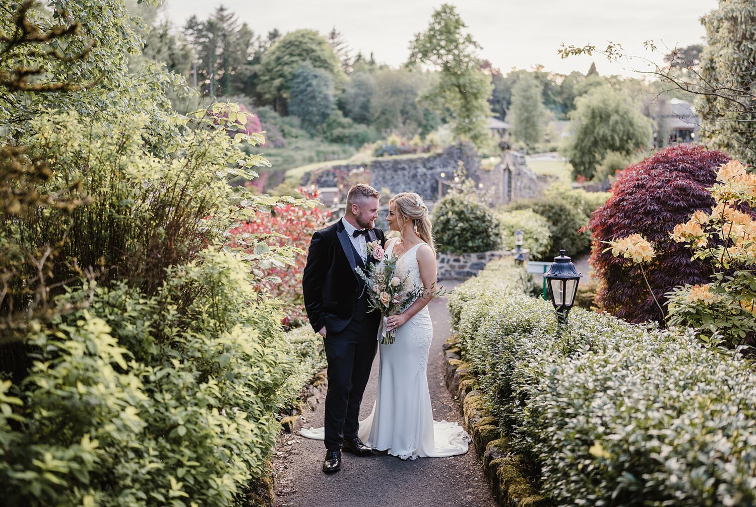 outdoor wedding at Galgorm with bride and groom looking at each other