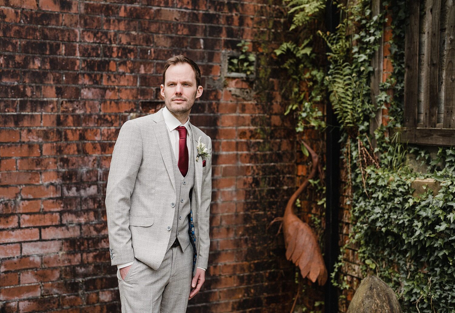 groom in wool tower wedding