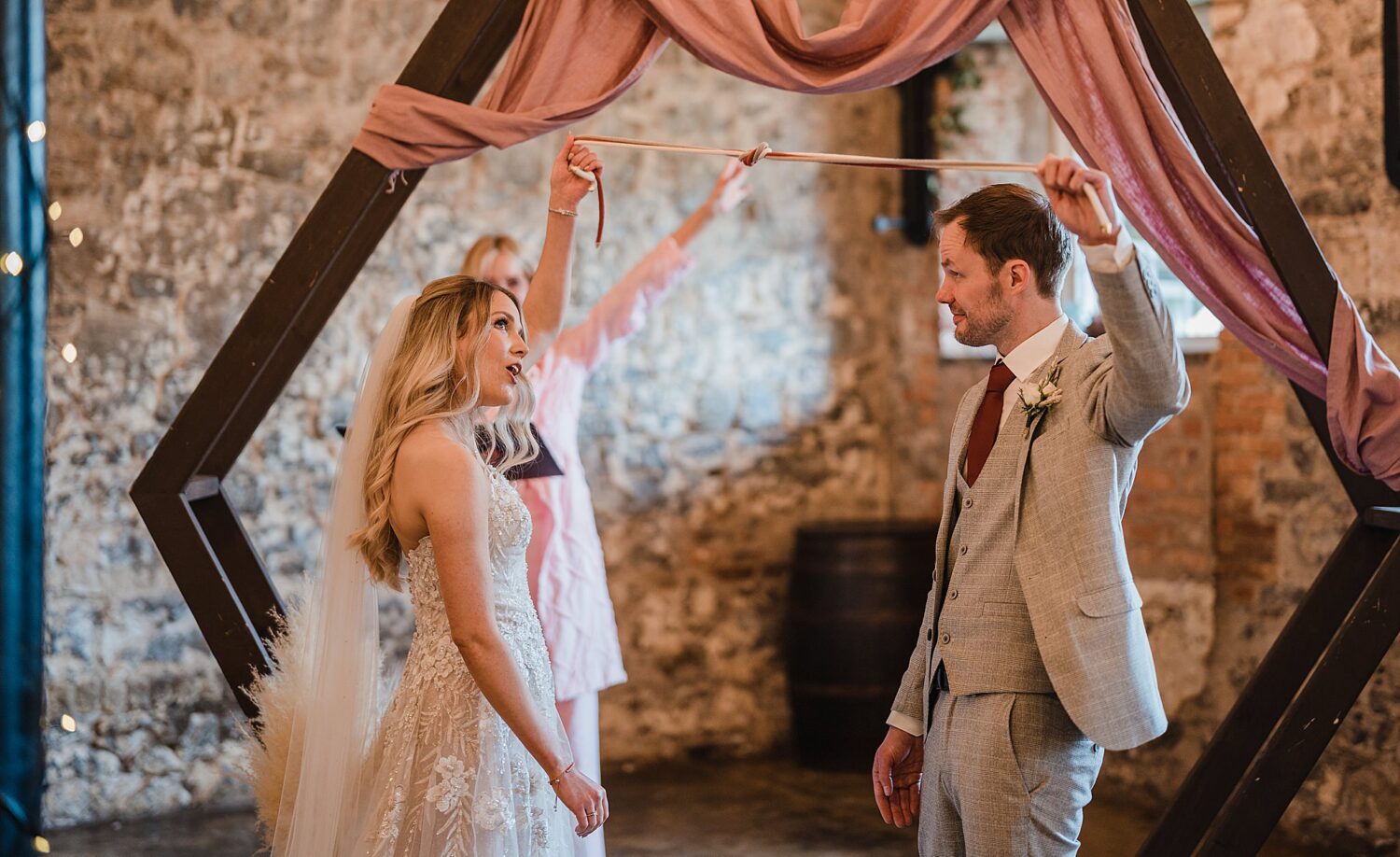 bride & groom tie the knot during ceremony at raceview mill
